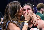 25 November 2023; Katie Taylor celebrates with her mother Bridget Taylor after defeating Chantelle Cameron in their undisputed super lightweight championship fight at the 3Arena in Dublin. Photo by Stephen McCarthy/Sportsfile