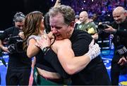 25 November 2023; Katie Taylor, and her manager Brian Peters, after her undisputed super lightweight championship fight with Chantelle Cameron at the 3Arena in Dublin. Photo by Stephen McCarthy/Sportsfile