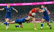 25 November 2023; Calvin Nash of Munster is tackled by Hugo Keenan of Leinster, left, and Robbie Henshaw during the United Rugby Championship match between Leinster and Munster at the Aviva Stadium in Dublin. Photo by Tyler Miller/Sportsfile