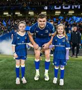 25 November 2023; Leinster co-captain Garry Ringrose walks out with matchday mascots Eabha Hurley and Katie Murphy before the United Rugby Championship match between Leinster and Munster at the Aviva Stadium in Dublin. Photo by Harry Murphy/Sportsfile
