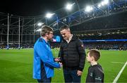 25 November 2023; OLSC president Alan Mooney makes a presentation to former Leinster captain Jonathan Sexton, alongside his son Luca, before the United Rugby Championship match between Leinster and Munster at the Aviva Stadium in Dublin. Photo by Harry Murphy/Sportsfile
