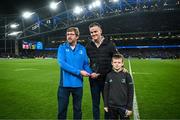 25 November 2023; OLSC president Alan Mooney makes a presentation to former Leinster captain Jonathan Sexton, alongside his son Luca, before the United Rugby Championship match between Leinster and Munster at the Aviva Stadium in Dublin. Photo by Harry Murphy/Sportsfile