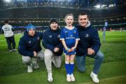25 November 2023; Matchday mascots Eabha Hurley with Leinster players Liam Turner, John McKee and Brian Deeny before the United Rugby Championship match between Leinster and Munster at the Aviva Stadium in Dublin. Photo by Harry Murphy/Sportsfile