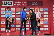26 November 2023; Cycling Ireland Chief Executive Officer, James Quilligan, presents the first place flowers to Stefano Viezzi of Italy after the Mens Junior race during Round 5 of the UCI Cyclocross World Cup at the Sport Ireland Campus in Dublin. Photo by David Fitzgerald/Sportsfile