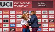 26 November 2023; Sport Ireland Chief Executive Officer, Dr Una May presents the second place flowers to Cat Ferguson of Great Britain after the Womens Junior race during Round 5 of the UCI Cyclocross World Cup at the Sport Ireland Campus in Dublin. Photo by David Fitzgerald/Sportsfile