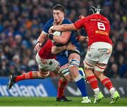25 November 2023; Joe McCarthy of Leinster in action against Jean Kleyn, left, and Gavin Coombes of Munster during the United Rugby Championship match between Leinster and Munster at the Aviva Stadium in Dublin. Photo by Sam Barnes/Sportsfile