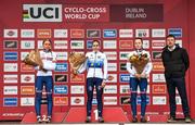 26 November 2023; Cycling Ireland Chief Executive Ofiicer, James Quilligan, right, stands for a photograph with cyclists from left, second place Cat Ferguson of Great Britain, first place Célia Gery of France, and third place Imogen Wolff of Great Britain, after the Womens Junior race during Round 5 of the UCI Cyclocross World Cup at the Sport Ireland Campus in Dublin. Photo by David Fitzgerald/Sportsfile