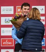 26 November 2023; Sport Ireland Chief Executive Officer, Dr Una May presentes the second place flowers to Emiel Verstrynge of Belgium after the Mens Under-23 race during Round 5 of the UCI Cyclocross World Cup at the Sport Ireland Campus in Dublin. Photo by David Fitzgerald/Sportsfile