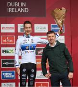 26 November 2023; Cycling Ireland Chief Executive Officer, James Quilligan, right, stands for a photograph with third place Jente Michels of Belgium, after the Mens Under-23 race during Round 5 of the UCI Cyclocross World Cup at the Sport Ireland Campus in Dublin. Photo by David Fitzgerald/Sportsfile