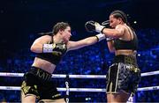 25 November 2023; Katie Taylor, left, and Chantelle Cameron during their undisputed super lightweight championship fight at the 3Arena in Dublin. Photo by Stephen McCarthy/Sportsfile