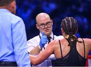 25 November 2023; The ringside doctor gives the go ahead for Chantelle Cameron to continue in her undisputed super lightweight championship fight with Katie Taylor at the 3Arena in Dublin. Photo by Stephen McCarthy/Sportsfile