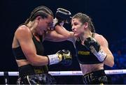 25 November 2023; Katie Taylor, right, and Chantelle Cameron during their undisputed super lightweight championship fight at the 3Arena in Dublin. Photo by Stephen McCarthy/Sportsfile