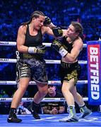 25 November 2023; Katie Taylor, right, and Chantelle Cameron during their undisputed super lightweight championship fight at the 3Arena in Dublin. Photo by Stephen McCarthy/Sportsfile