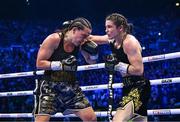 25 November 2023; Katie Taylor, right, and Chantelle Cameron during their undisputed super lightweight championship fight at the 3Arena in Dublin. Photo by Stephen McCarthy/Sportsfile