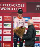 26 November 2023; Sport Ireland Chief Operations Officer, Michael Murray, presents the first place flowers to Tibor Del Grosso of Netherlands after the Mens Under-23 race during Round 5 of the UCI Cyclocross World Cup at the Sport Ireland Campus in Dublin. Photo by David Fitzgerald/Sportsfile