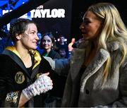 25 November 2023; Katie Taylor celebrates with boxer Amy Broadhurst, right, after defeating Chantelle Cameron in her undisputed super lightweight championship fight at the 3Arena in Dublin. Photo by Stephen McCarthy/Sportsfile