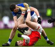 26 November 2023; Lee Brennan of Trillick in action against Michael McCarville of Scotstown during the AIB Ulster GAA Football Senior Club Championship semi-final match between Scotstown, Monaghan, and Trillick, Tyrone, at BOX-IT Athletic Grounds in Armagh. Photo by Ramsey Cardy/Sportsfile