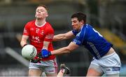 26 November 2023; James Garrity of Trillick in action against Darren Hughes of Scotstown during the AIB Ulster GAA Football Senior Club Championship semi-final match between Scotstown, Monaghan, and Trillick, Tyrone, at BOX-IT Athletic Grounds in Armagh. Photo by Ramsey Cardy/Sportsfile