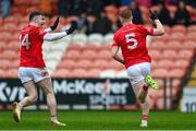 26 November 2023; Daley Tunney of Trillick celebrates with Lee Brennan, left, after scoring their side's first goal during the AIB Ulster GAA Football Senior Club Championship semi-final match between Scotstown, Monaghan, and Trillick, Tyrone, at BOX-IT Athletic Grounds in Armagh. Photo by Ramsey Cardy/Sportsfile