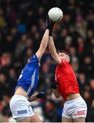 26 November 2023; Darren Hughes of Scotstown in action against Richard Donnelly of Trillick during the AIB Ulster GAA Football Senior Club Championship semi-final match between Scotstown, Monaghan, and Trillick, Tyrone, at BOX-IT Athletic Grounds in Armagh. Photo by Ramsey Cardy/Sportsfile
