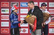 26 November 2023; Minister of State for Sport and Physical Education, Thomas Byrne TD, presents the first place flowers to Lucinda Brand of Netherlands after the Elite Womens race during Round 5 of the UCI Cyclocross World Cup at the Sport Ireland Campus in Dublin. Photo by David Fitzgerald/Sportsfile