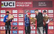 26 November 2023; Minister of State for Sport and Physical Education, Thomas Byrne TD, presents the first place flowers to Lucinda Brand of Netherlands after the Elite Womens race during Round 5 of the UCI Cyclocross World Cup at the Sport Ireland Campus in Dublin. Photo by David Fitzgerald/Sportsfile