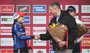 26 November 2023; Minister of State for Sport and Physical Education, Thomas Byrne TD, presents the first place flowers to Lucinda Brand of Netherlands after the Elite Womens race during Round 5 of the UCI Cyclocross World Cup at the Sport Ireland Campus in Dublin. Photo by David Fitzgerald/Sportsfile