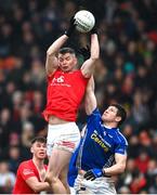26 November 2023; Richard Donnelly of Trillick in action against Darren Hughes of Scotstown during the AIB Ulster GAA Football Senior Club Championship semi-final match between Scotstown, Monaghan, and Trillick, Tyrone, at BOX-IT Athletic Grounds in Armagh. Photo by Ramsey Cardy/Sportsfile