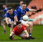 26 November 2023; Daniel Donnelly of Trillick in action against Conor McCarthy, left, and Jason Carey of Scotstown during the AIB Ulster GAA Football Senior Club Championship semi-final match between Scotstown, Monaghan, and Trillick, Tyrone, at BOX-IT Athletic Grounds in Armagh. Photo by Ramsey Cardy/Sportsfile
