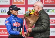 26 November 2023; Cycling Ireland President Tom Daly presents the second place flowers to Ceylin del Carmen Alvarado of Netherlands after the Elite Womens race during Round 5 of the UCI Cyclocross World Cup at the Sport Ireland Campus in Dublin. Photo by David Fitzgerald/Sportsfile