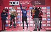 26 November 2023; Minister of State for Sport and Physical Education, Thomas Byrne TD, presents the first place flowers to Pim Ronhaar of Netherlands after the Elite Mens race during Round 5 of the UCI Cyclocross World Cup at the Sport Ireland Campus in Dublin. Photo by David Fitzgerald/Sportsfile