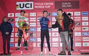 26 November 2023; Minister of State for Sport and Physical Education, Thomas Byrne TD, presents the first place flowers to Pim Ronhaar of Netherlands after the Elite Mens race during Round 5 of the UCI Cyclocross World Cup at the Sport Ireland Campus in Dublin. Photo by David Fitzgerald/Sportsfile