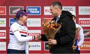 26 November 2023; Minister of State for Sport and Physical Education, Thomas Byrne TD, presents the first place flowers to Zoe Backstedt of Great Britain after the Womens-U23 race during Round 5 of the UCI Cyclocross World Cup at the Sport Ireland Campus in Dublin. Photo by David Fitzgerald/Sportsfile