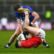 26 November 2023; Lee Brennan of Trillick in action against Michael McCarville of Scotstown during the AIB Ulster GAA Football Senior Club Championship semi-final match between Scotstown, Monaghan, and Trillick, Tyrone, at BOX-IT Athletic Grounds in Armagh. Photo by Ramsey Cardy/Sportsfile
