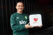 27 November 2023; Republic of Ireland's Katie McCabe presents a defibrillator to Kilnamanagh AFC at their team hotel in Castleknock, Dublin. Photo by Stephen McCarthy/Sportsfile