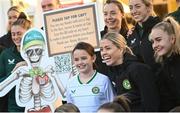 27 Novmeber 2023; Republic of Ireland players Denise O'Sullivan, left, and Izzy Atkinson with Isabelle Forrester, age 9, during a visit to Cappagh Kids and The National Orthopaedic Hospital Cappagh in Dublin to launch the Cappagh Hospital Foundation Christmas Appeal and their fundraising ambassador Boney Maloney. Photo by Ramsey Cardy/Sportsfile