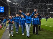 25 November 2023; Leah Tarpey, centre, and the Leinster Rugby Women's team parade at half-time of the United Rugby Championship match between Leinster and Munster at the Aviva Stadium in Dublin. Photo by Harry Murphy/Sportsfile