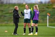 28 November 2023; Interim head coach Eileen Gleeson with Kyra Carusa and Izzy Atkinson, right, during a Republic of Ireland women training session at the FAI National Training Centre in Abbotstown, Dublin. Photo by Stephen McCarthy/Sportsfile