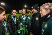 28 November 2023; Republic of Ireland's Katie McCabe and Denise O'Sullivan, right, with members of the Ireland women's cerebral palsy team, who were recently crowned champions of the International Federation of CP Football Nations League for 2023, at the FAI National Training Centre in Abbotstown, Dublin. Photo by Stephen McCarthy/Sportsfile