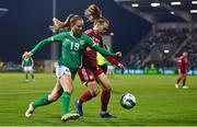 1 December 2023; Kyra Carusa of Republic of Ireland in action against Dóra Zeller of Hungary during the UEFA Women's Nations League B match between Republic of Ireland and Hungary at Tallaght Stadium in Dublin. Photo by Seb Daly/Sportsfile