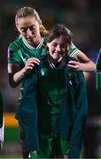 1 December 2023; Megan Connolly of Republic of Ireland puts her jacket onto a matchday mascot before the UEFA Women's Nations League B match between Republic of Ireland and Hungary at Tallaght Stadium in Dublin. Photo by Ben McShane/Sportsfile