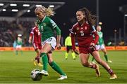 1 December 2023; Denise O'Sullivan of Republic of Ireland in action against Diána Németh of Hungary during the UEFA Women's Nations League B match between Republic of Ireland and Hungary at Tallaght Stadium in Dublin. Photo by Ben McShane/Sportsfile