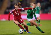 1 December 2023; Dóra Zeller of Hungary in action against Ruesha Littlejohn of Republic of Ireland during the UEFA Women's Nations League B match between Republic of Ireland and Hungary at Tallaght Stadium in Dublin. Photo by Seb Daly/Sportsfile