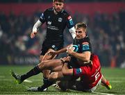 1 December 2023; Stafford McDowall of Glasgow Warriors is tackled by Tom Ahern of Munster during the United Rugby Championship match between Munster and Glasgow Warriors at Musgrave Park in Cork. Photo by Eóin Noonan/Sportsfile