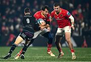 1 December 2023; Antoine Frisch of Munster is tackled by Sean Kennedy of Glasgow Warriors during the United Rugby Championship match between Munster and Glasgow Warriors at Musgrave Park in Cork. Photo by Eóin Noonan/Sportsfile