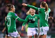 1 December 2023; Republic of Ireland players, from left, Sinead Farrelly, Denise O'Sullivan, and Kyra Carusa, celebrates after their side's first goal, an own goal scored by Henrietta Csiszár of Hungary, not pictured, during the UEFA Women's Nations League B match between Republic of Ireland and Hungary at Tallaght Stadium in Dublin. Photo by Seb Daly/Sportsfile