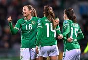 1 December 2023; Republic of Ireland players, from left, Kyra Carusa, Heather Payne, and Lucy Quinn, celebrate after their side's first goal, an own goal scored by Henrietta Csiszár of Hungary, not pictured, during the UEFA Women's Nations League B match between Republic of Ireland and Hungary at Tallaght Stadium in Dublin. Photo by Seb Daly/Sportsfile