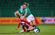 1 December 2023; Katie McCabe of Republic of Ireland is tackled by Boglárka Vida of Hungary during the UEFA Women's Nations League B match between Republic of Ireland and Hungary at Tallaght Stadium in Dublin. Photo by Ben McShane/Sportsfile