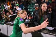1 December 2023; Megan Connolly of Republic of Ireland takes a photograph with supporters after her side's victory in the UEFA Women's Nations League B match between Republic of Ireland and Hungary at Tallaght Stadium in Dublin. Photo by Seb Daly/Sportsfile