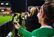 1 December 2023; Jamie Finn of Republic of Ireland takes a photograph with supporters after their side's victory in the UEFA Women's Nations League B match between Republic of Ireland and Hungary at Tallaght Stadium in Dublin. Photo by Seb Daly/Sportsfile